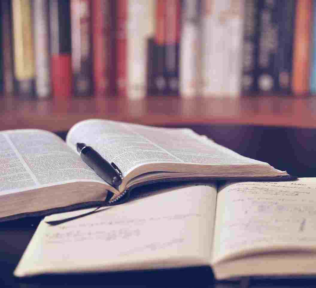 oer books books laid open wiht pen inside